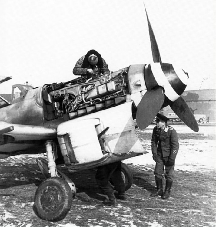 Messerschmitt-Bf-109G6R6-JG3-under-going-maintenance-01.jpg