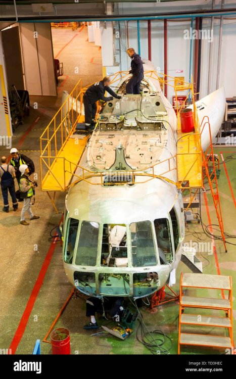 tyumen-russia-june-5-2019-aircraft-repair-helicopter-utair-engineering-plant-mi-8-helicopter-during-maintencance-and-repair-at-the-service-hanga-TD3HEC.jpeg